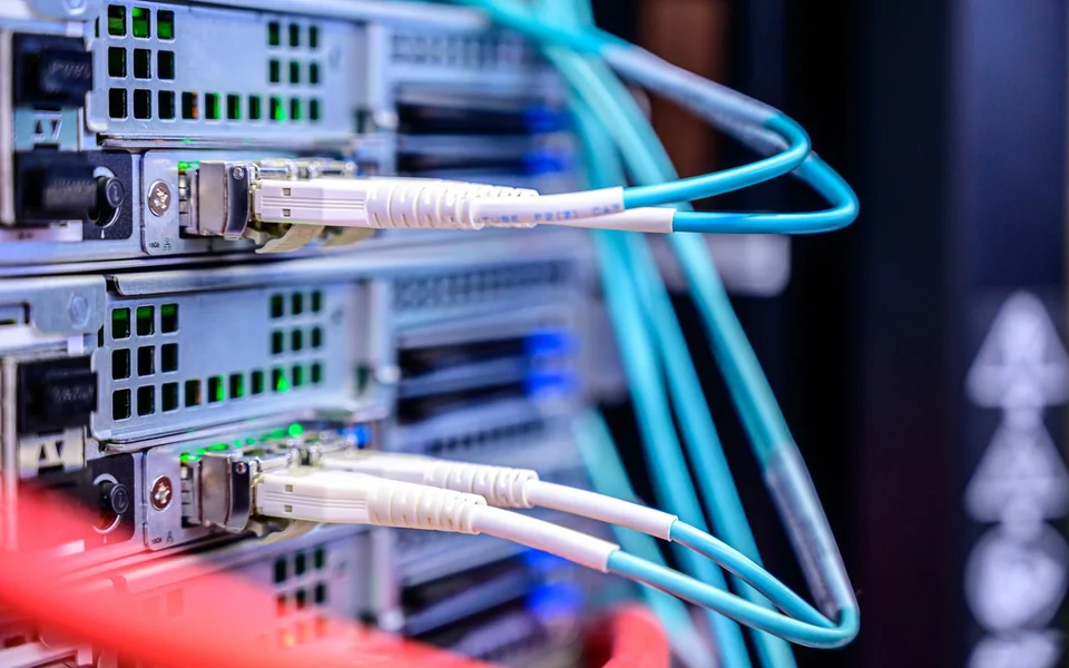 Network cables connected to equipment in a server rack